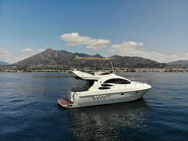 Yacht Charter in Marbella — Azimut 39 motor yacht cruising past La Concha mountain in Marbella