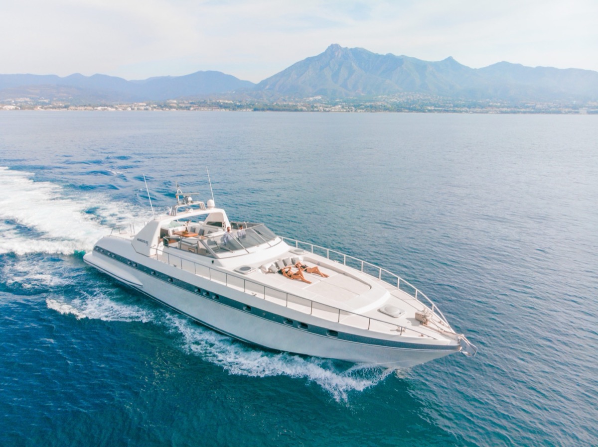 Mangusta 80 'Nina' cruising past La Concha mountain in Marbella — the biggest charter yacht on the Costa del Sol