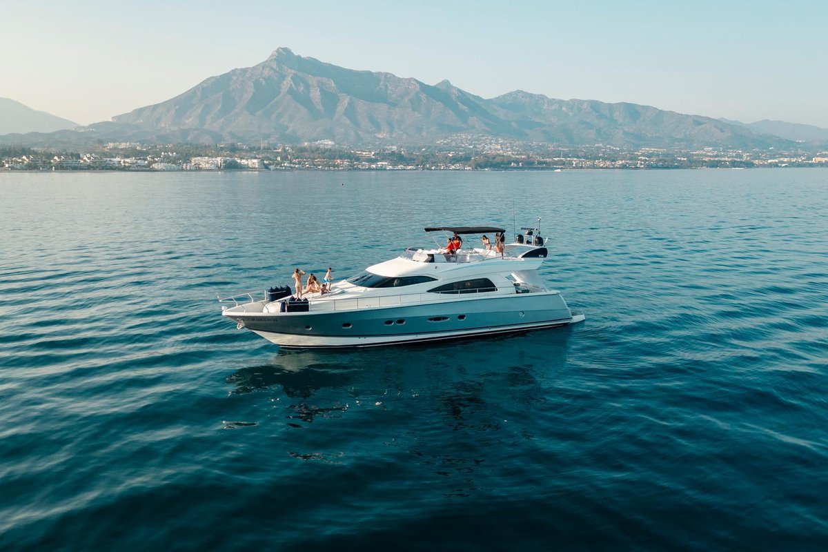 Nuvari 64 "Avaco" motor yacht anchored off Marbella with La Concha mountain behind